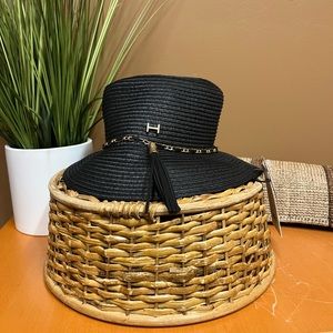 Black hat with braided trim and tassel